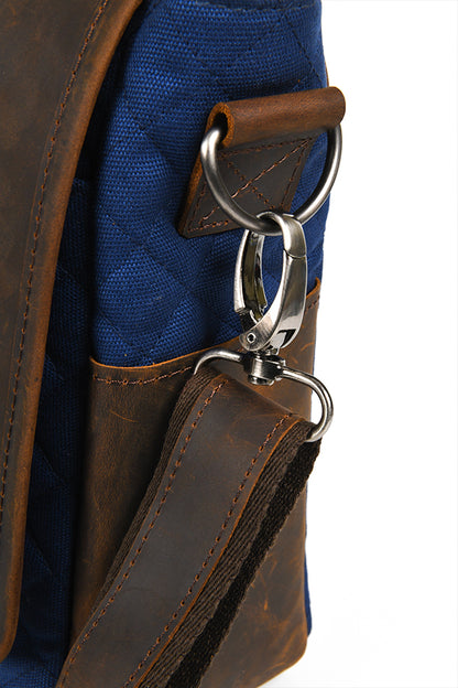 Detail shot of the detachable metal hardware connecting the strap to the bag.