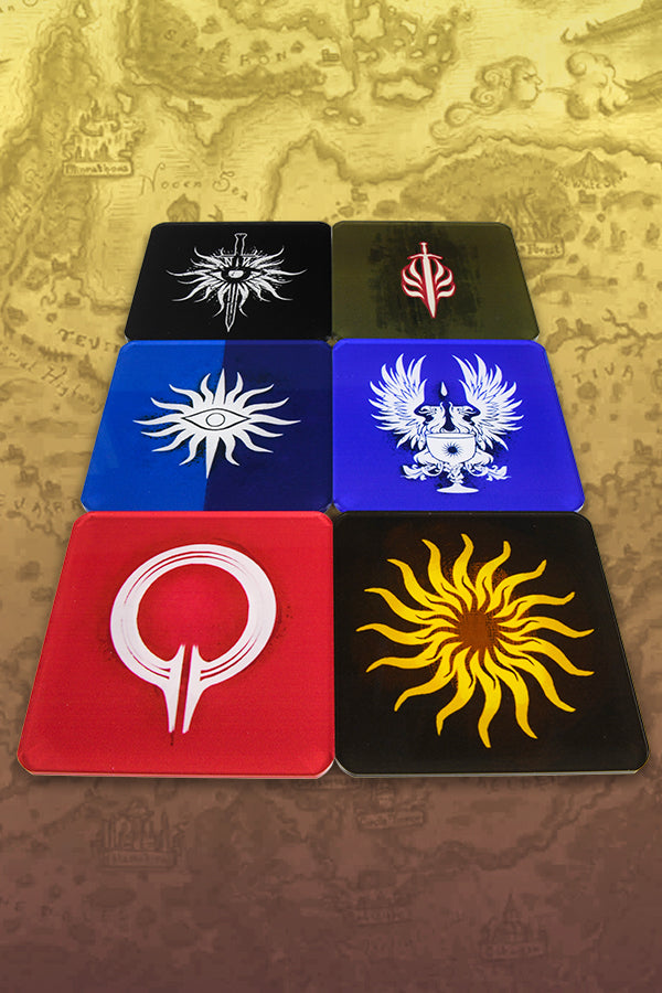 Image showing all 6 designs of the Dragon Age Coaster Set. All coasters are shown lying down with 3 coasters on each side.   Each coaster is made with an acrylic top over design on paper with transparent anti-skid feet. Each coaster is showing one of the six Dragon Age: Inquisition Heraldry Symbols.