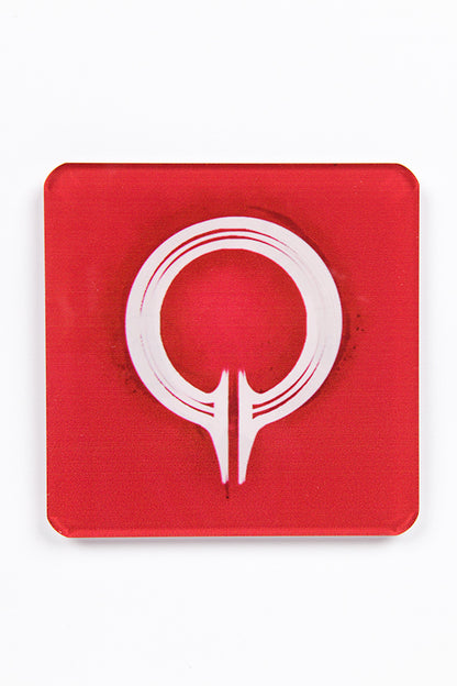 Image shows coaster with the symbol (white in color) of the Circle of Magi over a red background. 