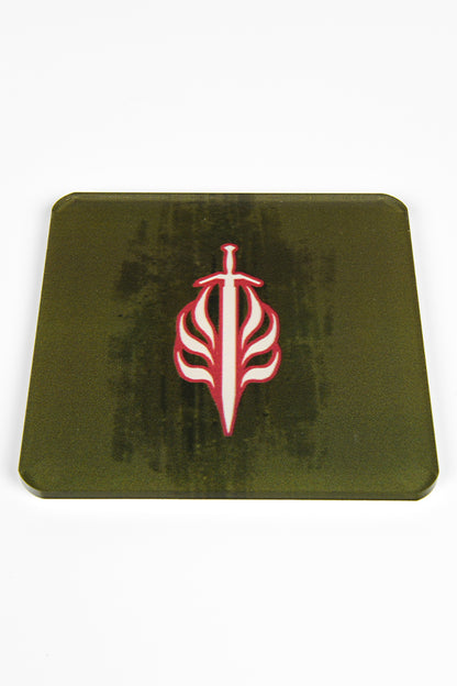 Image shows Coaster with the Templar of Order heraldry symbol.  The symbol is white with red outlines showing a sword pointing down with 3 flames on each side on a green background. 