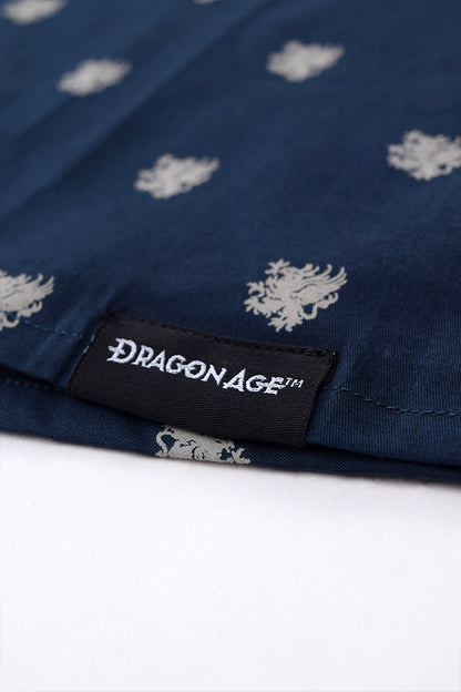Image shows Dragon Age woven tag upclose at the wearer's left hem.