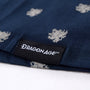 Image shows Dragon Age woven tag upclose at the wearer's left hem.