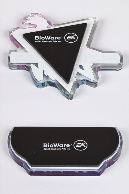 Image shows both the Chora's Den magnet and Eternity Lounge magnet laid flat facing back. The back of the magnets highlights the Bioware and EA logos.