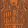 Image shows the wooden box facing front with the carved Alistair design zoomed in.