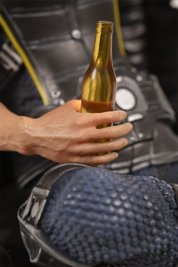 Image shows Mass Effect Kaidan Alenko Statue's hand holding the beer zoomed in. If Kaidan survived Virmire, he continued to serve under Shepard aboard the Normandy. During a routine patrol hunting for geth forces, the ship came under attack from a warship belonging to the enigmatic Collectors and Shepard forced Alenko to evacuate with the rest of the crew.
