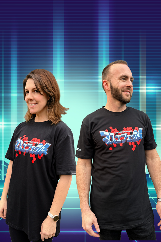Image shows both female and male model facing at opposite angles. This Mass Effect official Japanese Logo Tee takes inspiration from the special Japanese edition and comes in a cool 100% cotton jersey fabric. Soft and light, this comfy Tee features chest, back and right sleeve prints to keep it with the vibrant theme.
