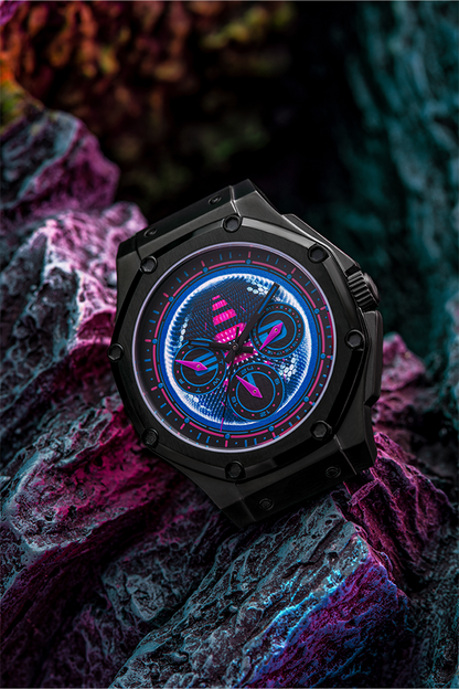 Image shows Mass Effect EDI Watch resting on a rock formation facing front at an angle. Product boasts a Japanese multifunctional movement that powers her subdials and features a durable scratch-resistant mineral crystal. With only 500 pieces available, she is incredibly rare and available only until stocks last.