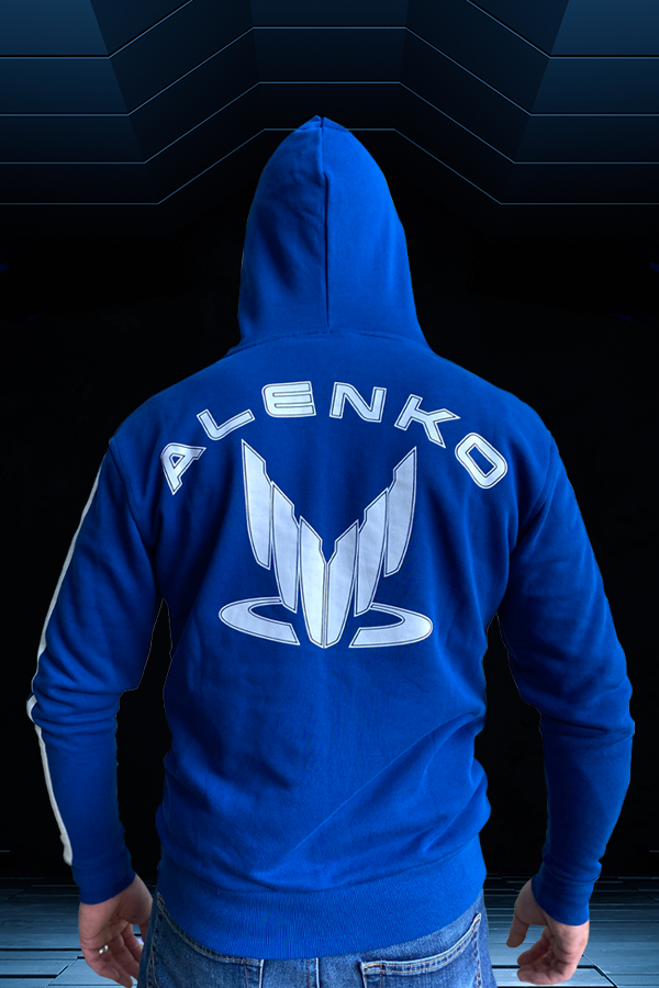 Image shows Mass Effect Team Alenko Hoodie worn by model facing back, The hoodie comes with a yellow Spectre logo on the left chest panel and a white Spectre logo with Alenko printed at the rear. An adjustable hood, a zipper front, and kangaroo pockets offer the functional details to make this Team Alenko hoodie your go-to.