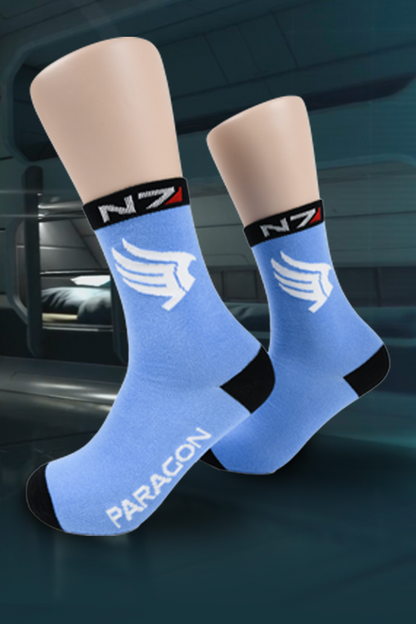 Image shows Paragon Socks worn on mannequin feet, Paragon socks features a blue color with the Paragon logo and text printed on the socks.