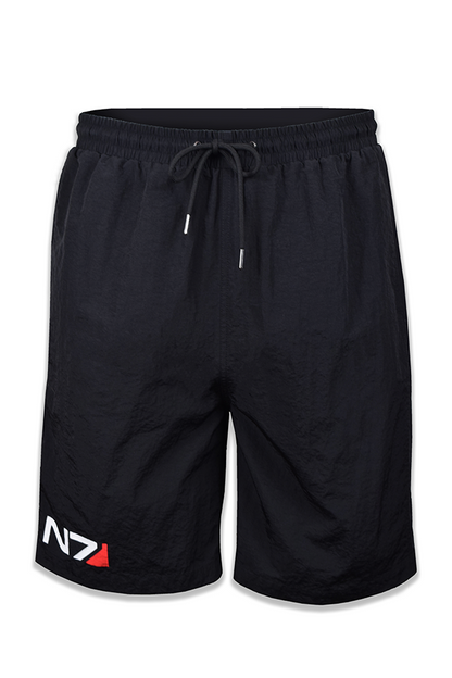 Image shows Mass Effect N7 Active Shorts facing front. Product is designed to keep you moving and active. These performance shorts offer unrestricted mobility. Product features the N7 logo and comes with a functional design that includes a stretchy waistband, drawstring, and mid-rise. 