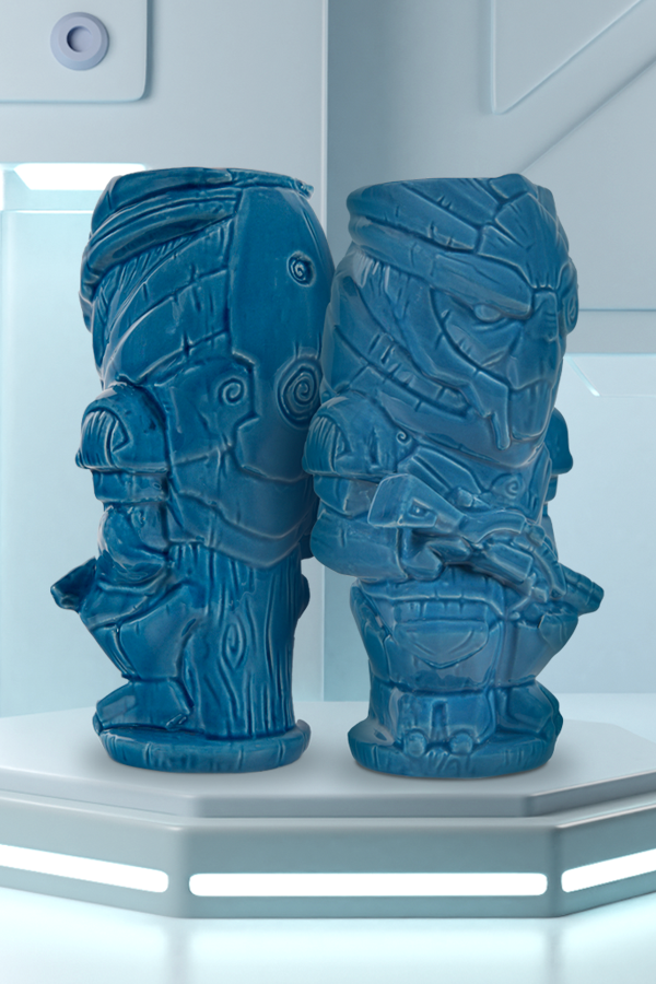 Image shows 2 Mass Effect Garrus Geeki Tiki Mugs facing away from each other. Feared by Omega’s crime empires and mercenary groups everywhere, Garrus infiltrated well into enemy territory and caused unprecedented damage. With his legendary armored suit, witty one-liners, and an iconic reunion at the Kima District, this blue-eyed warrior has given us plenty to remember him by. And with this Tiki, there’ll be plenty more to come.