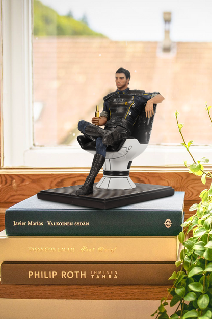 Image shows Mass Effect Kaidan Alenko Statue on top of 3 books that are laid flat. Made using polyresin, this Kaidan Alenko Statue is available in limited numbers and comes individually numbered.