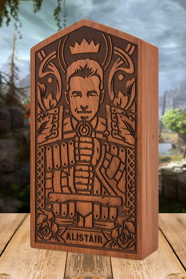 Image shows the front cover of the wooden box included in the Dragon Age Alistair Romance Bundle. The box is decorated with an MDF carved design of Alistair. 
