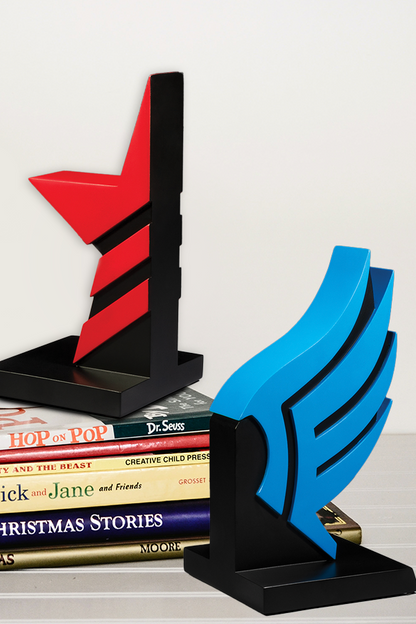 Image shows Mass Effect Paragon and Renegade Bookends standing up with the Renegade bookend on top of a pile of books. Product is made with Polyresin and sculpted by Bigshot Toyworks.