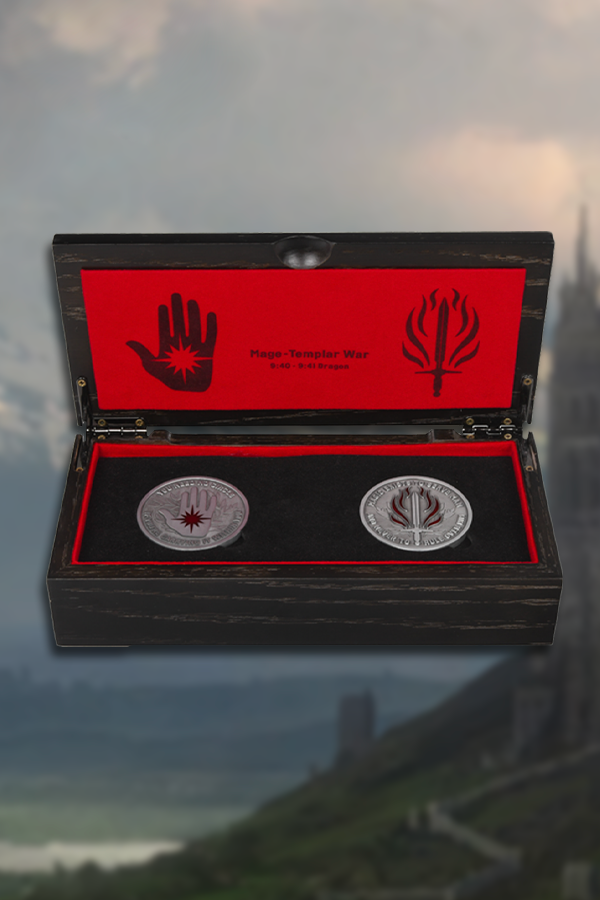 Image shows Dragon Age Mage-Templar War Coin Set's box opened with both coins sitting in a velvet-lined display. The box is a black wooden box with red lining and colored artwork of the Mage-Templar war.