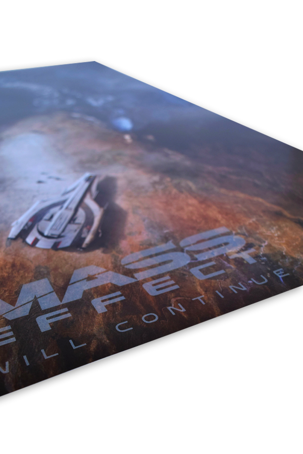 Image shows Mass Effect Mysteries from the Future Lithograph laid flat at an angle. Product features a 24" x 18" lithograph made with high quality printing and a special pearl gloss finish.