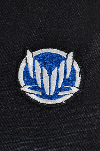 Image shows Mass Effect Ships and Stations Blueprint Scarf zoomed in at the embroidered Spectre Emblem logo. Spectres (Special Tactics and Reconnaissance, also abbreviated as ST&R) are agents entrusted with extraordinary authority by the Citadel Council, including the power of life and death over the inhabitants of the galaxy. They form an elite group selected from a number of different species, and their primary responsibility is to preserve galactic stability by whatever means necessary.