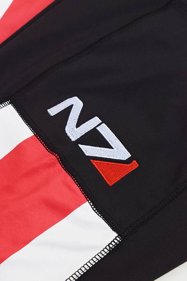 Image shows Mass Effect N7 Ankle Legging zoomed in. Product features an N7 embroidery on wearer's right pocket.