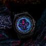 Image shows Mass Effect EDI Watch sitting on a rock formation facing front. The watch case is made with 316 Stainless Steel and lens features a scratch-resistant mineral crystal. The watch is 100 meters resistant and uses an SR battery.
