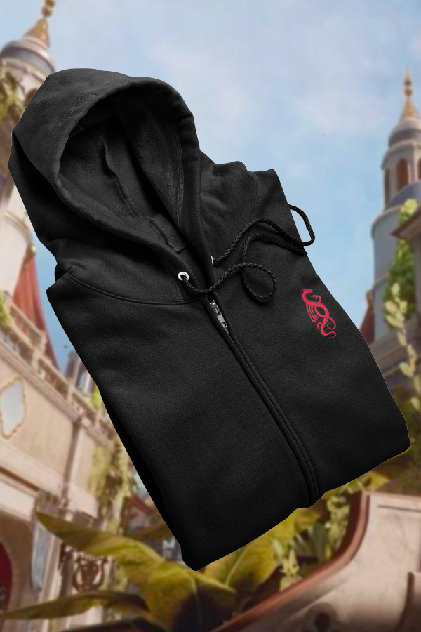 Image shows Dragon Age Tevinter Hoodie folded and laid flat facing at an angle, Product features flat drawcords and covered zipper.