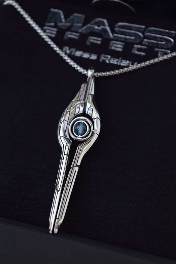 Image shows Mass Effect Mass Relay Pendant facing front. The Pendant is 55mm x 13mm x 4mm with a 24" chain.