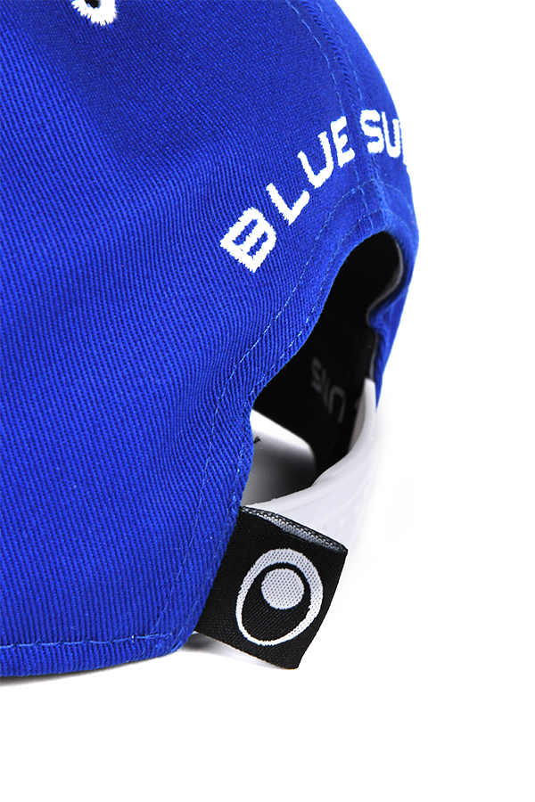 Image shows Mass Effect Blue Suns Hat zoomed in at the back. Product is made with 100% Cotton Twill with a white snap back closure.