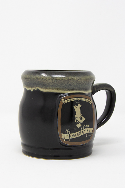 Image shows Dragon Age The Hanged Man Tavern Mug facing at an angle. Product has a C-handle and is Microwave safe.