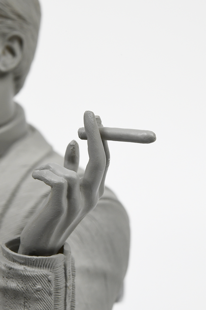 Image is zoomed in at Illusive Man Prototype Statue's left hand holding a cigar. Product is made with an acrylic base and polyresin.
