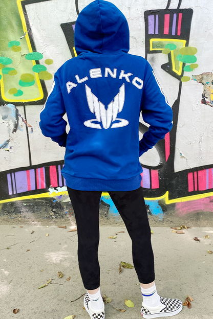 Image shows Mass Effect Team Alenko Hoodie worn by model facing back. Kaidan Alenko is a human Sentinel and a Systems Alliance Marine. While serving aboard the SSV Normandy, he is a Staff Lieutenant and head of the ship's Marine detail.