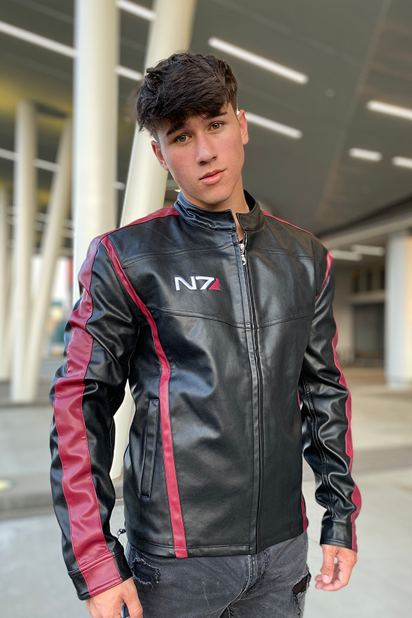 Image shows Mass Effect N7 Jacket Reimagined worn by male model facing front. Jacket is black with dark red stripes and an N7 logo on the right chest,