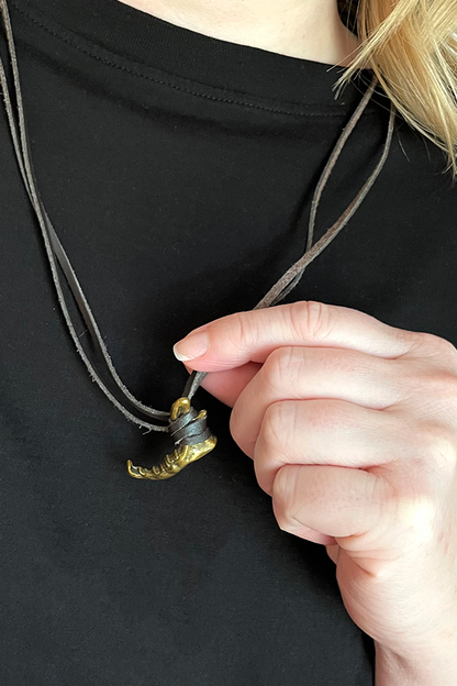  Image shows Dragon Age Solas Jawbone Necklace worn by model with the necklace zoomed in. Product is 1 3/8"W x 7/8"H
