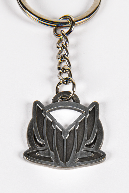 Image shows Spectre charm facing front. The Spectre charm is made with zinc alloy and 1" in diameter.