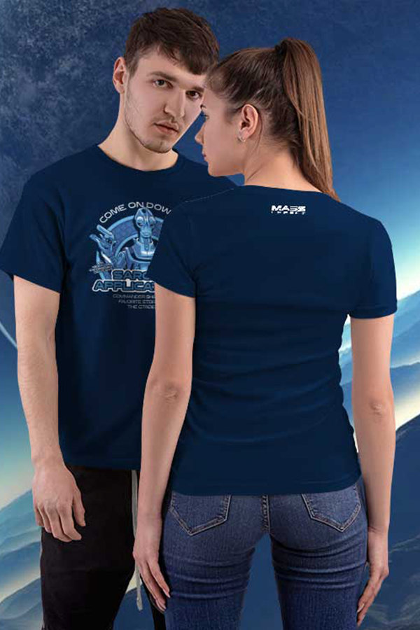 Image shows Mass Effect Saronis Applications Tee worn by a male and female model with the male model facing front and the female model facing back infront of him. Product features 100% cotton and taped shoulder to shoulder with the Mass Effect logo written at the back near the neck.