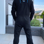 Image shows Mass Effect N7 Adult Onesie Reimagined worn by male model facing back. Product features back embroidery and N7 logo printed interior hood.