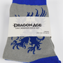 Image shows Dragon Age Grey Warden gray socks folded and laid flat. Product is made with 75% cotton, 23% polyester, 2% elastic.