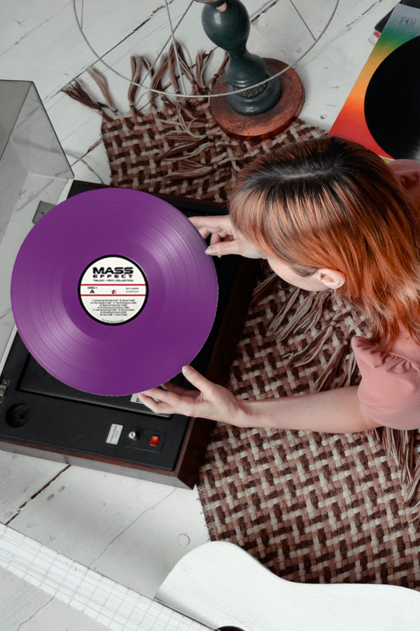 Image shows LP Vinyl held by female model on top of a record player. Immerse yourself in the vast soundscapes from the universe of Mass Effect. Whether it’s a memorable battle that you just can’t get your mind out of or the otherworldly background score that made even the small moments feel bigger, this 4 LP box set captures the futuristic sound of Mass Effect.