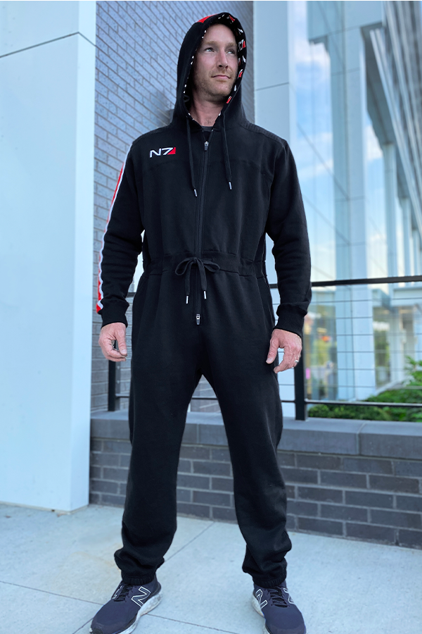 Image shows Mass Effect N7 Adult Onesie Reimagined worn by male model facing front at an angle.