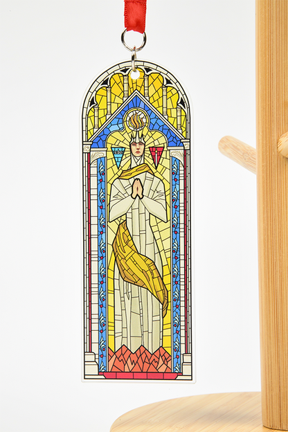 Image shows Dragon Age Andraste Stain Glass Holiday Ornament. According to Chantry scholars, Andraste was born into a prosperous Alamarri tribe in -203 Ancient (992 TE) in Denerim, though both the date and place of her birth are hotly contested. Her mother was a Ciriane woman named Brona and her father, Elderath, was the chieftain of one of the largest Alamarri tribes in what is now northern Ferelden. 