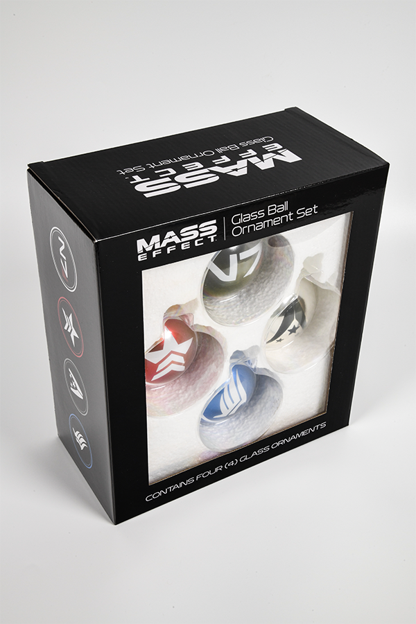 Image shows Mass Effect Glass Ball Ornament Set in its box with the box facing at an angle. 