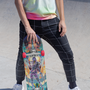  Image shows Mass Effect Tali Zorah Skate Deck held upright by model with the deck facing front. Tali'Zorah nar Rayya is a quarian and a member of Commander Shepard's squad. She is the daughter of Rael'Zorah, a member of the Admiralty Board. Though young, Tali is a mechanical genius.