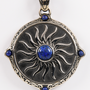 Image shows the Amulet Necklace zoomed in facing front. The amulet is from Alistair's mother with a beautiful embossed steel pendant that is decorated with 5 blue agate stones. The embossed design replicates the Chantry fire symbol to represent the purity of Andraste.
