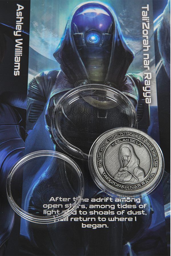 Image shows Mass Effect Coin Album's Tali'Zorah nar Rayya Coin. Coin features Tali'Zorah's logo in the middle and surrounded by one of her famous quotes. Tali'Zorah nar Rayya is a quarian and a member of Commander Shepard's squad. She is the daughter of Rael'Zorah, a member of the Admiralty Board. Though young, Tali is a mechanical genius.