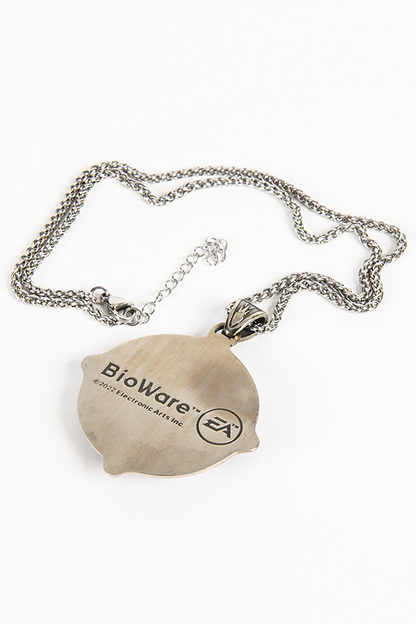 Image shows the Amulet Necklace laid flat facing back. The amulet 2.15" in diameter with embossed antique stainless steel. The back of the amulet has the Bioware and EA logo. 