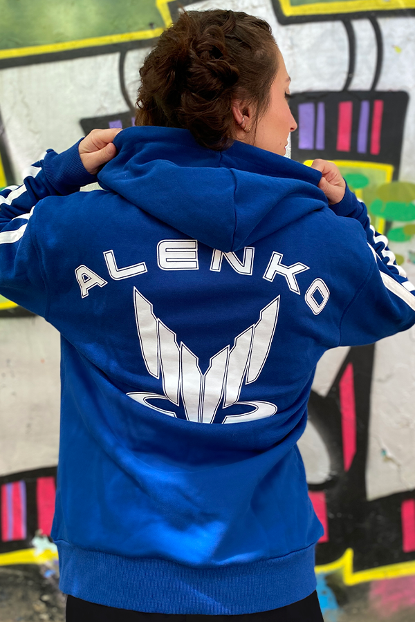 Image shows Mass Effect Team Alenko Hoodie worn by female model facing back.  He's also an initial member of Commander Shepard's squad. Kaidan is a biotic wired with the controversial L2 implants, which are known to cause severe neurological damage to the user. However, he is fortunate enough to only suffer from occasional severe migraines. He is a possible love interest.