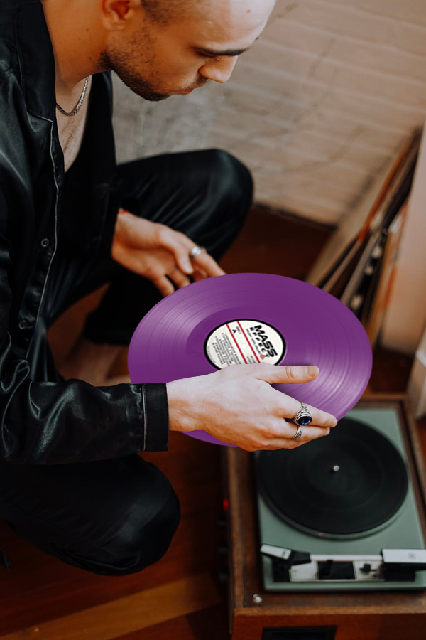 Image shows Vinyl LP hedld by male model on top of a record player. The Tali Variant Box Set features concept art and stills from the game on each vinyl sleeve. The mesmerizing images paint the perfect picture for enjoying the classics from the trilogy, like “The Citadel”, “Horizon”, “Shepard’s Tango” and a few unreleased bonus tracks to expand the experience.