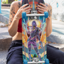  Image shows Mass Effect Tali Zorah Skate Deck held upright by sitting female model with the deck facing front. Product features a colorful fade-proof printing and artist's signature.