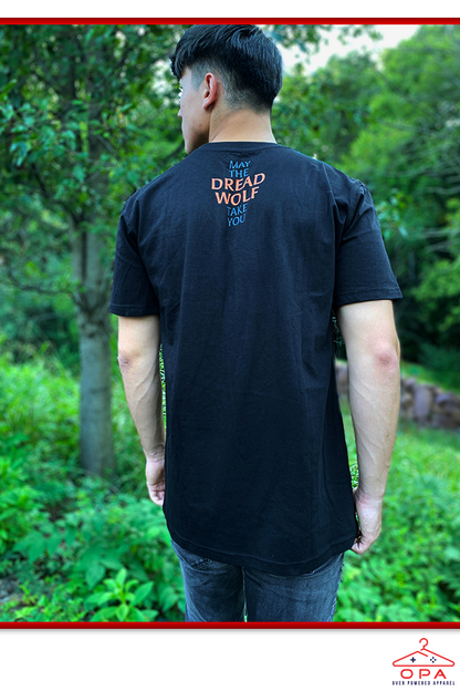 Image shows Dragon Age Dread Wolf OPA Tee worn by male model facing back. Product is a cut and sew custom tee with a Bioware collar tag.