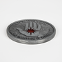 Image shows the Mage Coin laid flat upside down. Mage coin's side B features an embossed pattern of the Arcane Defender emblem with red enamel filling and text that reads, YOU NEED NO CIRCLE IF YOU'RE CARRYING IT WITHIN YOU.