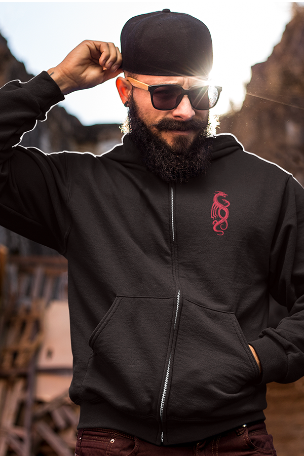 Image shows Dragon Age Tevinter Hoodie worn by male model facing front. The hoodie is made with high-quality cotton and polyester blended fabric that is light yet warm enough to keep you snug during colder months. Functional details include kangaroo pockets, an adjustable hood, and a zipper at the front.