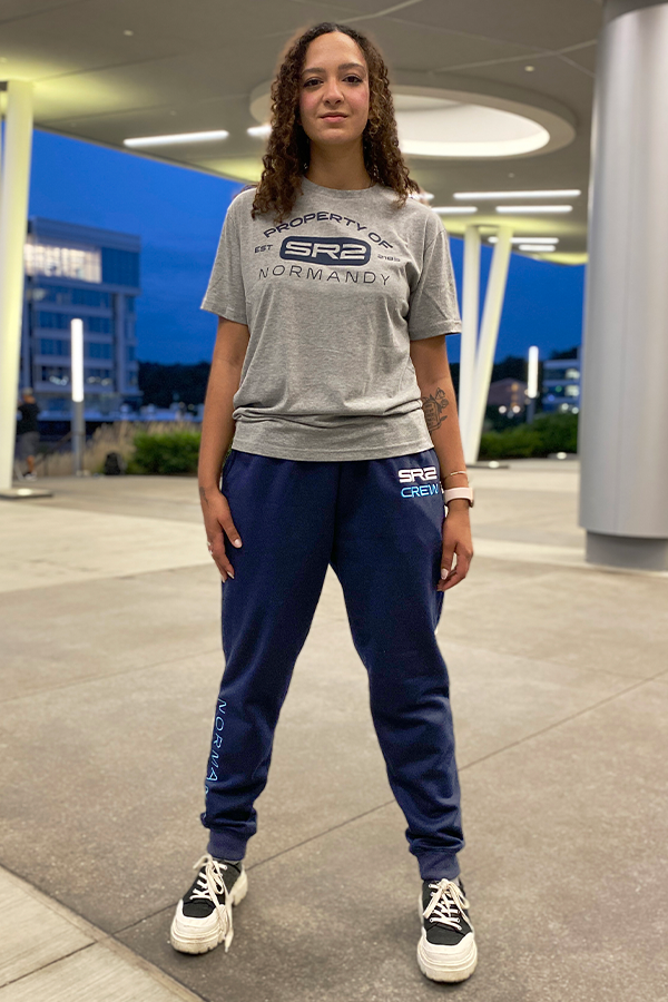 Image shows Mass Effect SR-2 Crew Member Lounge Set worn by female model. The Normandy SR-2 is a starship that serves as Commander Shepard's base of operations following the destruction of the SSV Normandy.